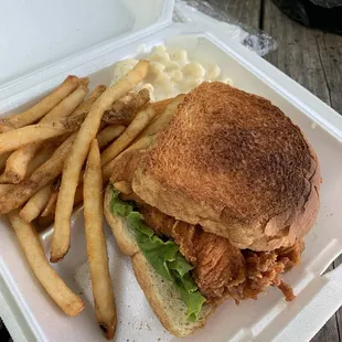 Chicken sandwich with fries and Mac and cheese