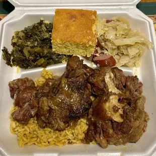 Oxtails over rice, collard greens, cornbread, cabbage