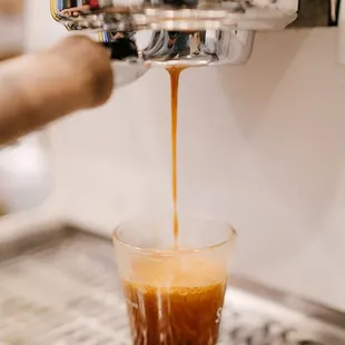 espressor pouring coffee into a cup