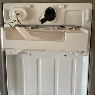 Today we replaced this ice maker inside of a Kenmore refrigerator because it was malfunctioning and no longer making ice.