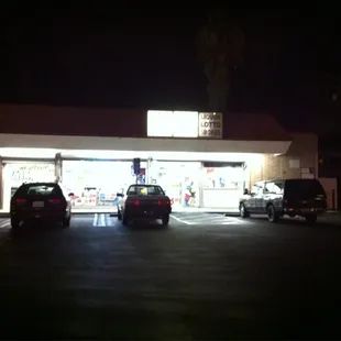 two cars parked in front of the store