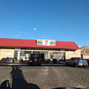 the front of a restaurant with a truck parked in front of it