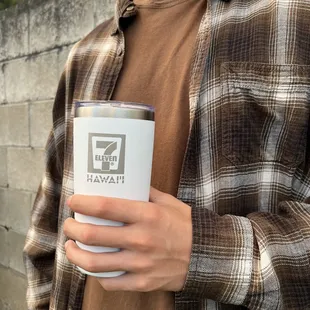 a man holding a coffee cup