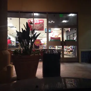 the outside of a store at night