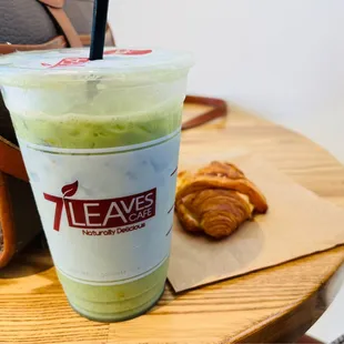 a cup of green tea and croissants