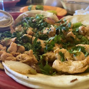 Chicken tacos, ceviche, molcajete.