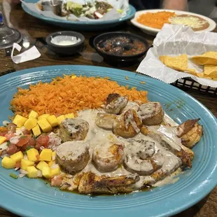 Mahi mahi with shrimp/ scallops. Mango salsa and rice