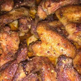 a closeup of a plate of chicken wings