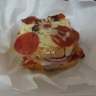 Loaded Grilled Cheese featuring pepperoni, sauteed mushrooms, peppers and onions with three cheeses!
