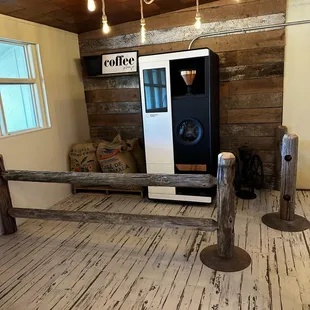 a coffee machine in the corner of a room
