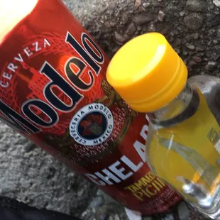 a can of soda and a can of hot sauce