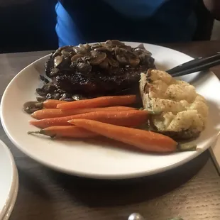Steak with roasted carrots and twice baked potato