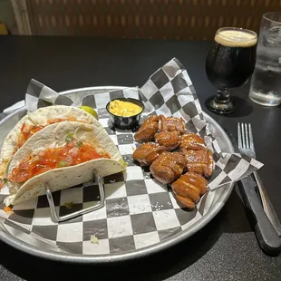 Blackened, fish, tacos, pretzel bites, with queso, and a craft, stout. Delicious!