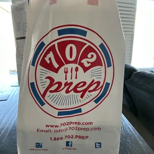The pickup/delivery bag of all the yummy food you ordered.