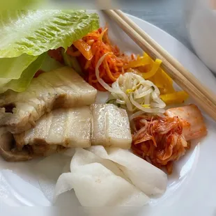 Takeout: my plate of Bo ssam and banchans (I ate more later but this is my first plate haha)