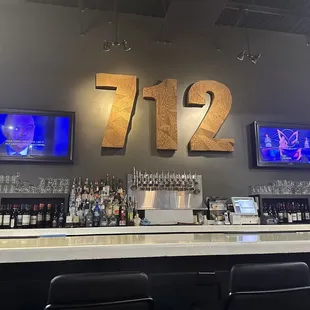 The cool sign behind the bar!