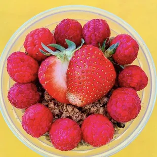 a bowl of strawberries and raspberries