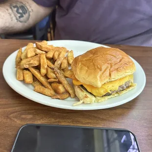 a burger and fries on a plate