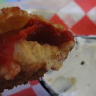 red jalapeno poppers with chili cream cheese inside, crispy outside