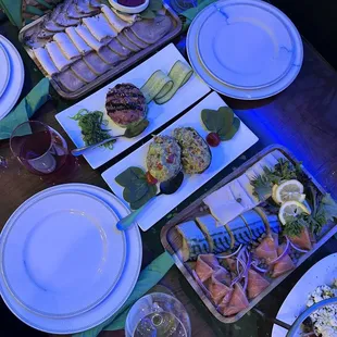 Les Assiettede Poisson Assorti (right) Tuna Tartar (2nd from the left) Avocado Salad (3rd from the left) Les Charcuterie Assorti (left)