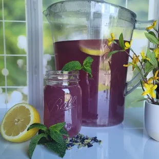 a pitcher of lemonade and a jar of mint