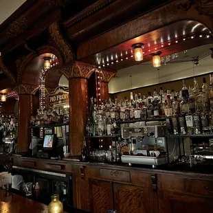 a bar with lots of liquor bottles