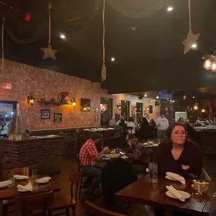 people sitting at tables in a restaurant