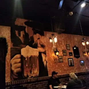 two people sitting at a table in a restaurant