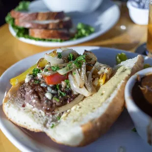 Blu Cheese Burger with grilled onions and bell peppers