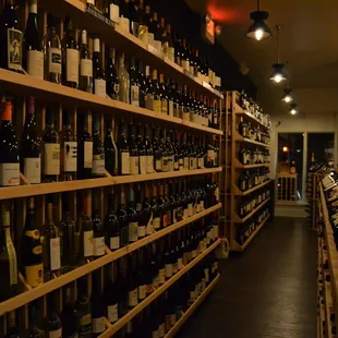 rows of wine bottles on shelves