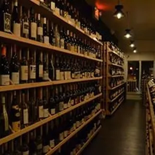 rows of wine bottles on shelves