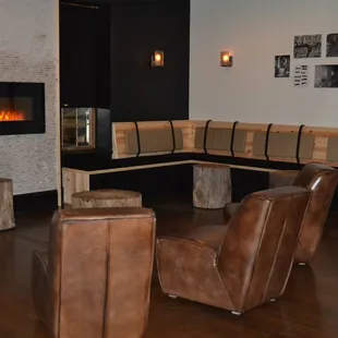 a corner seating area with a fireplace