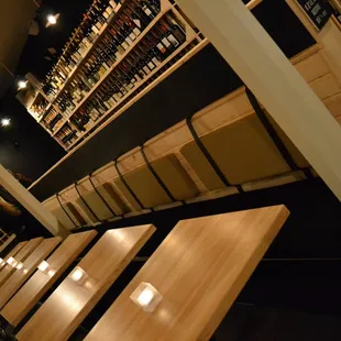 rows of wooden benches in a wine cellar