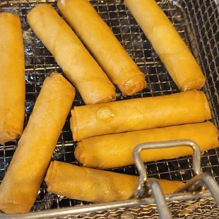 a basket of deep fried corn dogs