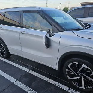 a white suv parked in a parking lot