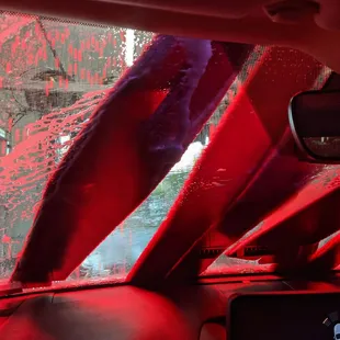the interior of a car with red paint