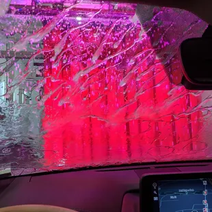 the inside of a car with a windshield covered in tin foil