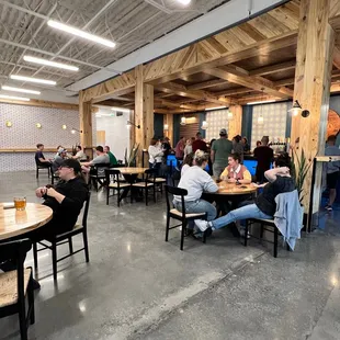 a large group of people sitting at tables