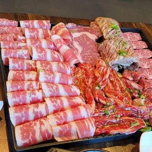 a tray of meat wrapped in bacon