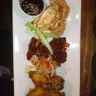 Asian sampler, chicken potstickers, barbecue pork wings and sweet  chili wings  w/ coleslaw