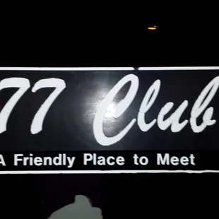 a sign for a friendly place to meet