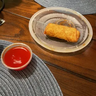 a plate of fried food and a bowl of ketchup