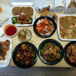 Clockwise from top left sesame shrimp, amazing shrimp, shrimp lo mein, shrimp with garlic sauce,  spicy crispy shrimp, gen tso&apos;s