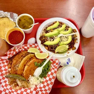 Quesabirria w/ consomé, Alambre Gitana w/ Charro beans, red and green salsa, and Jamaica.