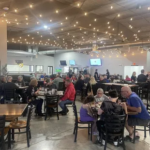 a large group of people sitting at tables