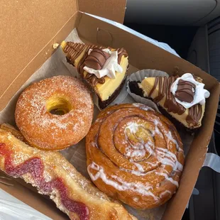 Guava &amp; cream cheese quesito, sugar donut, cinnamon roll, chocolate cheesecake with Nutella drizzle
