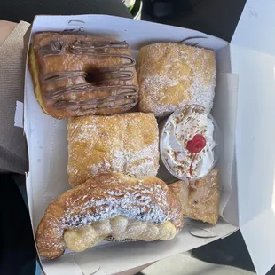 Nutella frosting donut, 2 sugar donuts, 1 tres leches, 1 bread budding and 1 coffee crème brûlée