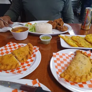 Empanadas of meat, chicken and octopus. Tostones and fried chicken with rice. Medalia  light beer.