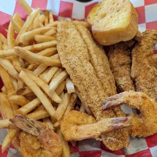 a basket of fried fish and fries