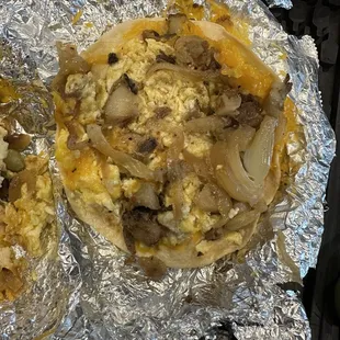 Potato, onion, egg and cheese  But I&apos;m missing the steak in all 3 tacos
